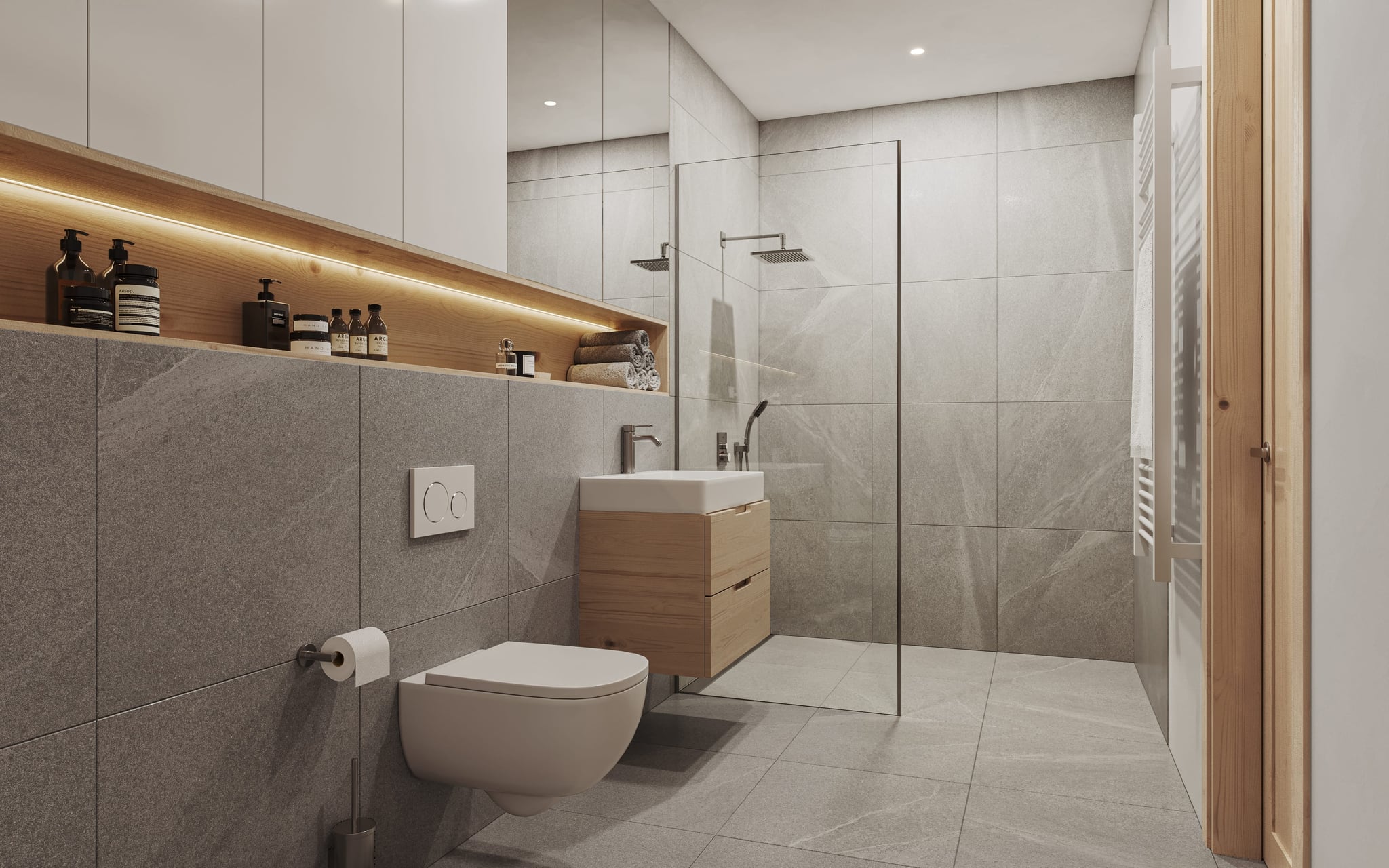 Bad mit bodengleicher Dusche und Holzdetails im Zenznhof Bad mit bodengleicher Dusche und Holzdetails im Zenznhof