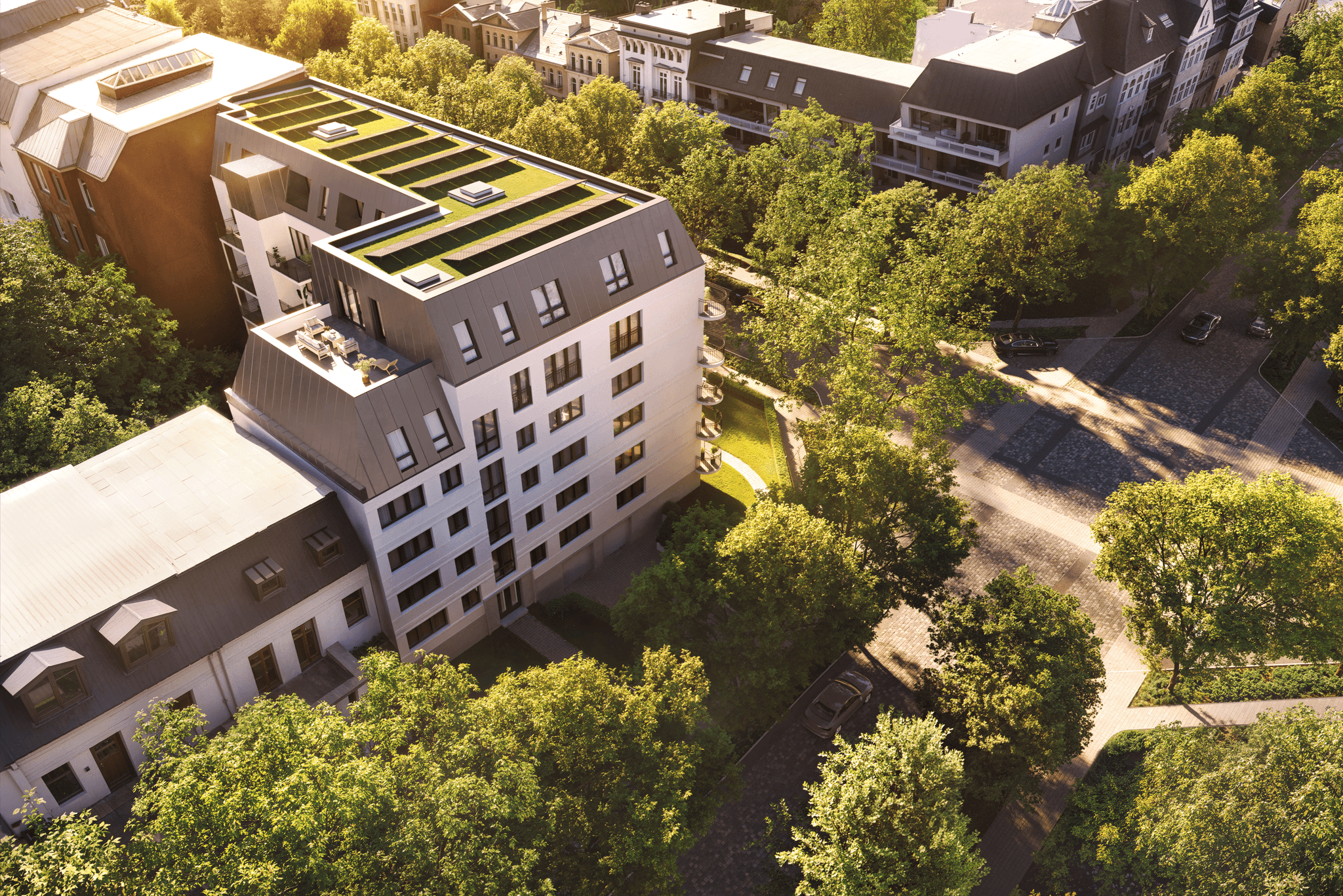 Evening view of the Parkallee building, illuminated with warm light, creating an inviting atmosphere. Evening view of the Parkallee building, illuminated with warm light, creating an inviting atmosphere.