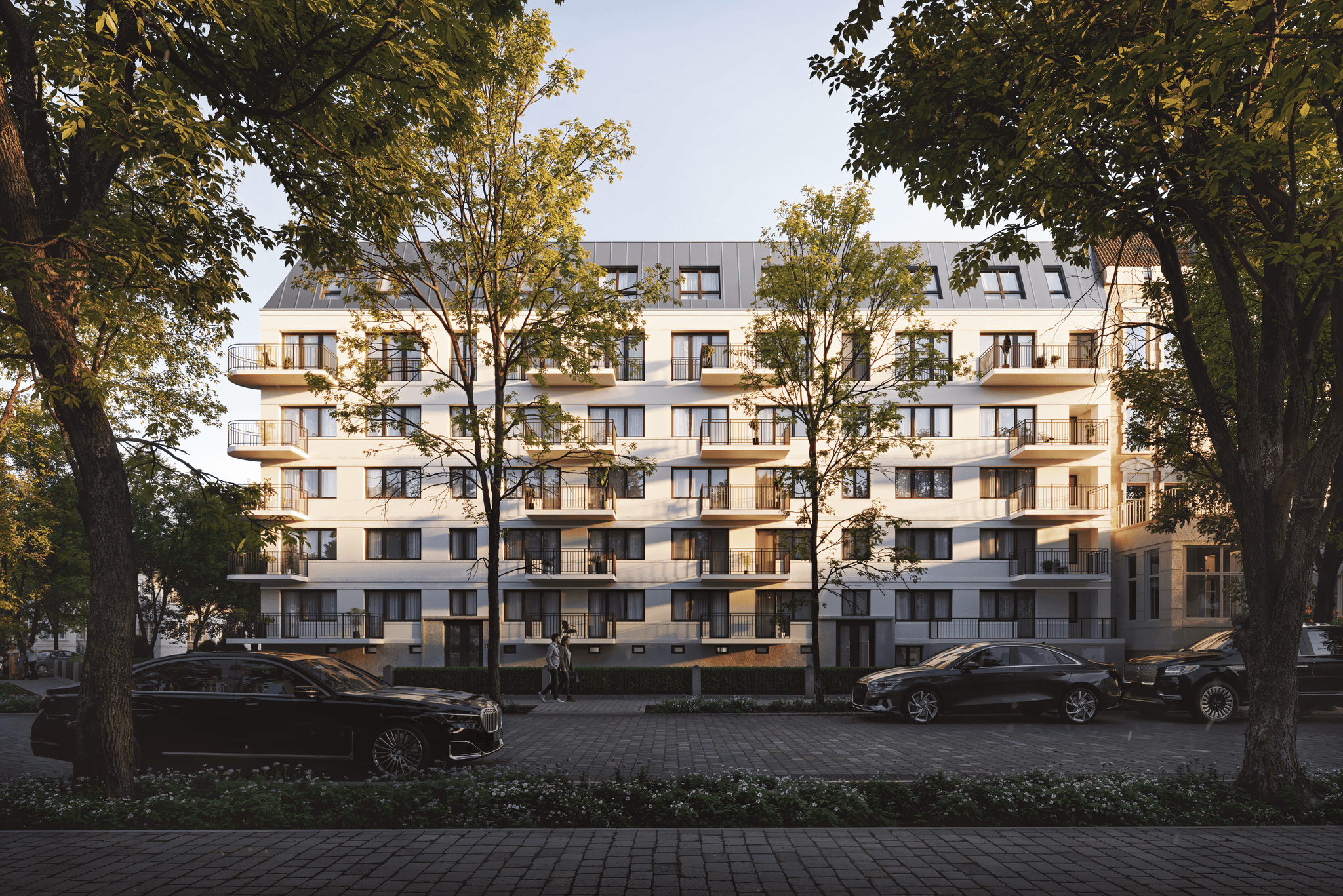 Modern exterior view of the Parkallee building in Hamburg, surrounded by green trees and a welcoming street environment.