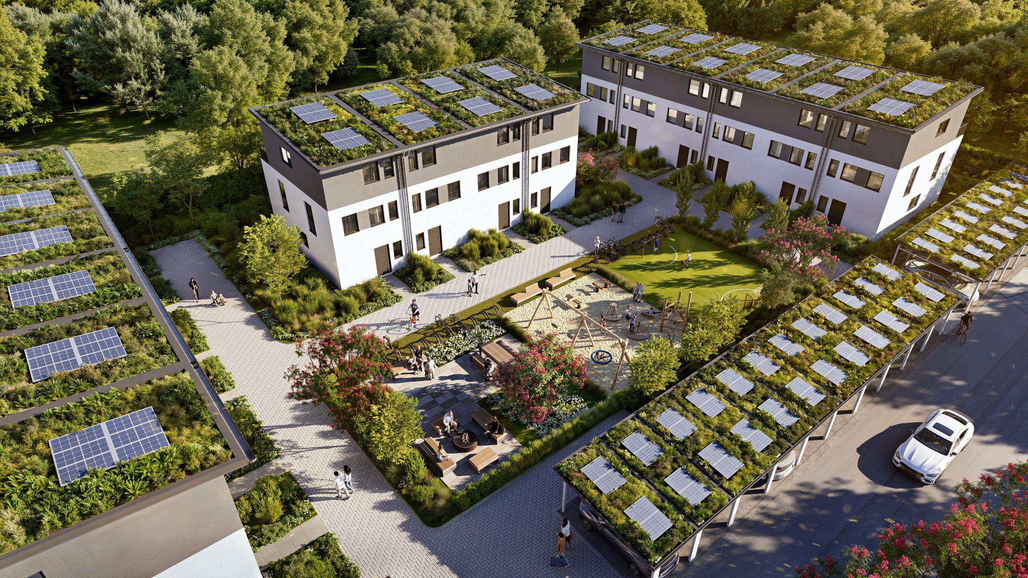 Aerial view of the Humboldtstraße residential complex with solar roofs, green communal areas, and modern buildings. Aerial view of the Humboldtstraße residential complex with solar roofs, green communal areas, and modern buildings.